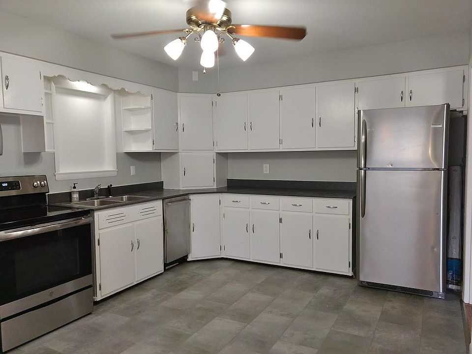 Kitchen with stainless appliances including dishwasher.