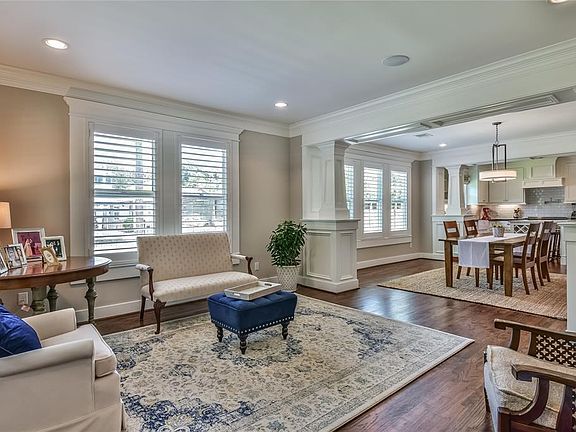 Masterfully designed living and dining spaces seamlessly flow together to create the perfect gathering place. Craftsman millwork, plantation shutters, hardwood floors and neutral finishes are just a few special features.