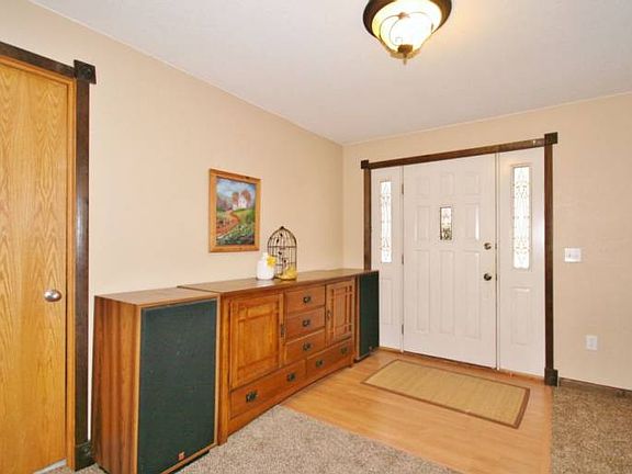 Entrance door has window panes on each side which add to the light entering the home.  Easy care vinyl floors and sharp neutral colors on the walls make decorating a breeze.