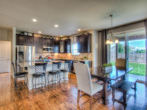 Dark Maple cabinetry & slab granite