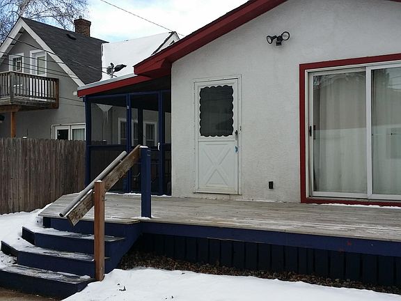 back of hosue with large deck