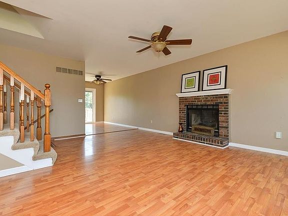 As you enter the home you are greeted with a brick fireplace.