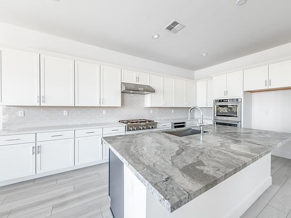 Well-equipped kitchen with beautiful cabinets and ample countertop space