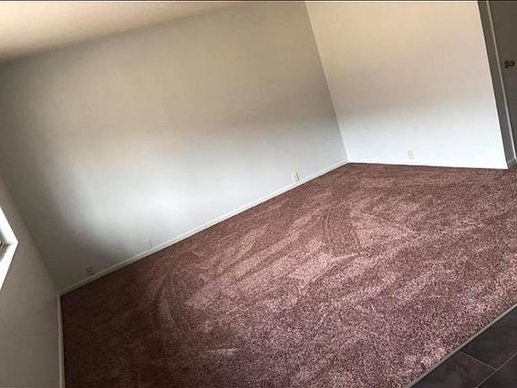 Living room with new carpet and paint.