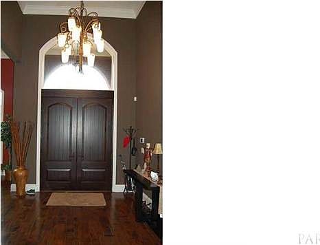 Custom mahogany doors set the stage for the continued amenities and high end finishes throughout the house
