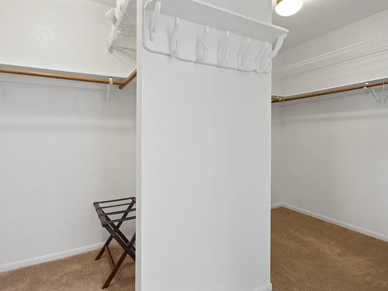 Spacious his and hers walk-in closet
