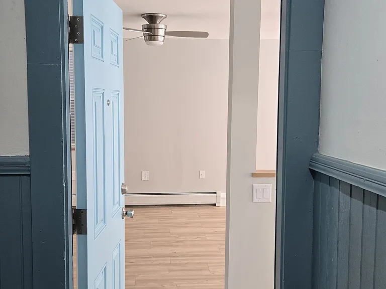 Entry door to the apartment with peep-hole!