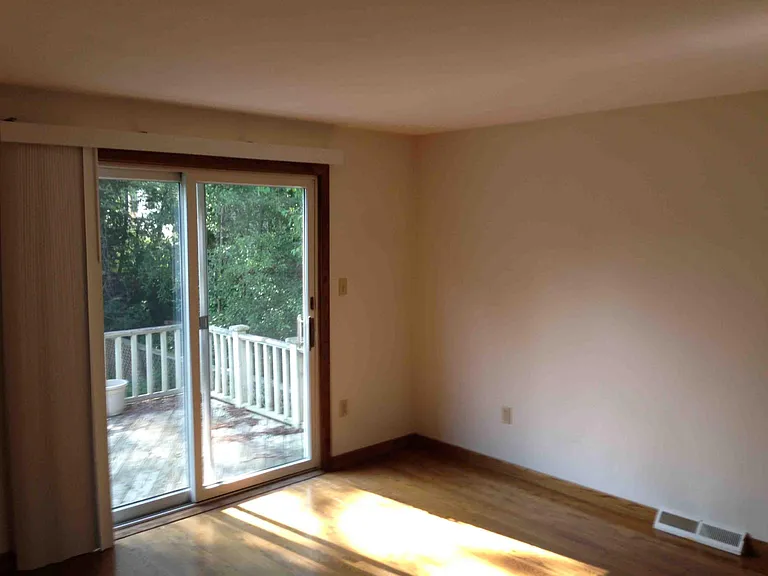 Bedroom with Sliding Door to Deck that overlooks back yard and Bath attached to bedroom