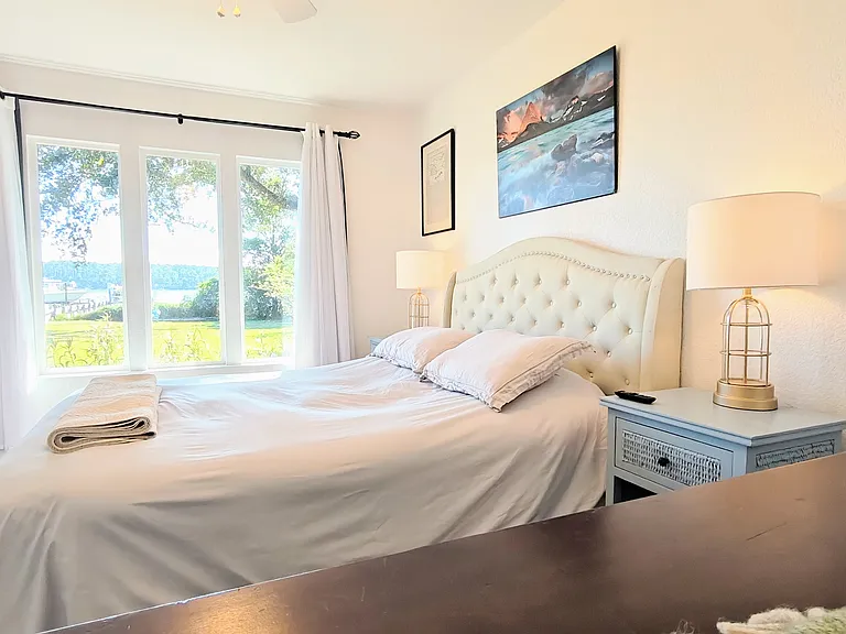 Front bedroom with gorgeous water views. Each bedroom has it's own closet. Closet is behind to the left of the viewer.