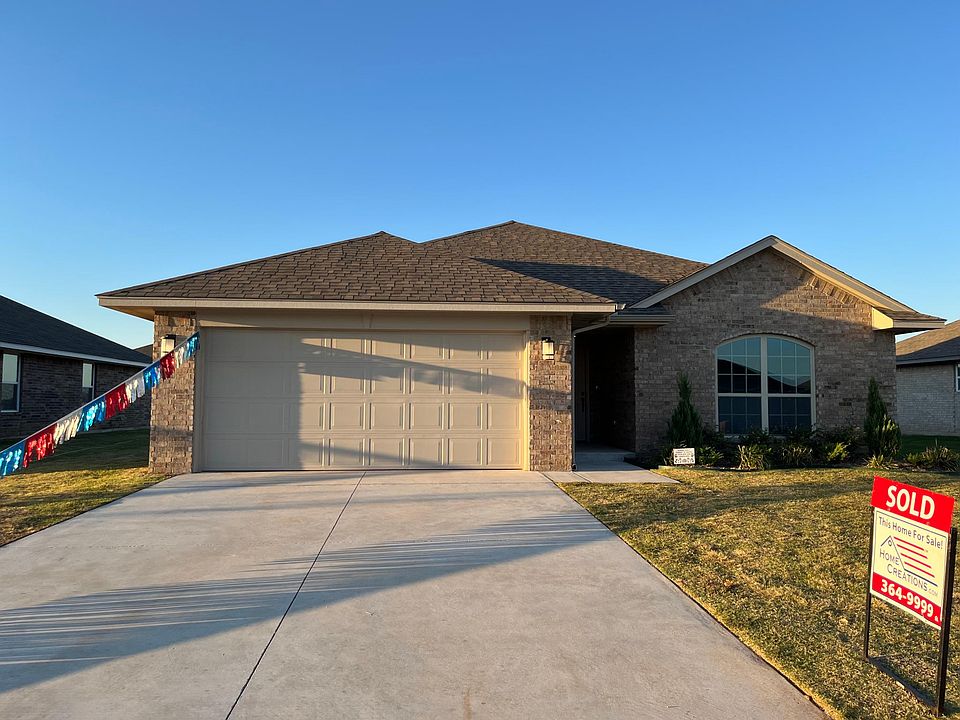 Front of newly built home with extra long driveway.