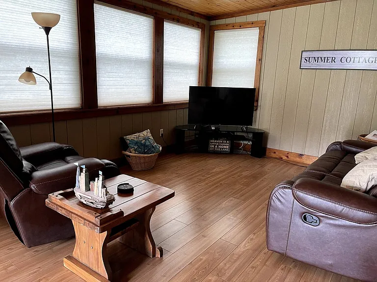 Watch TV on the new leather sofas. Close the blinds for privacy or open to take in the views of the water