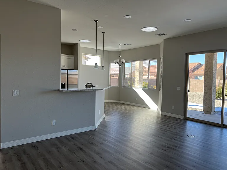 From Living Room looking into Dining Area and Slider to the back Patio