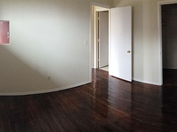 bedroom of one bedroom with wood floors