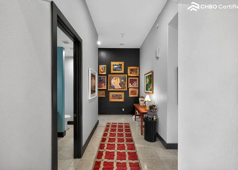 Private hallway leads to spacious primary wing