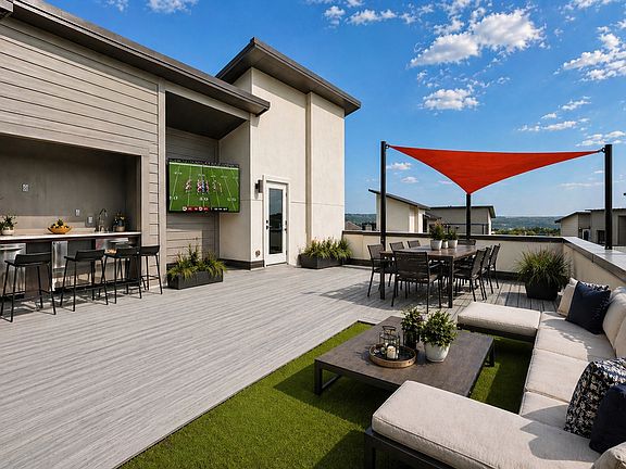 Expansive private rooftop deck with composite wood flooring,with a large wet bar & dedicated turf area, all set against breathtaking Lake Travis Hill Country view. Perfect for entertaining, sunbathing, or stargazing under the Texas sky. Life is Good here!