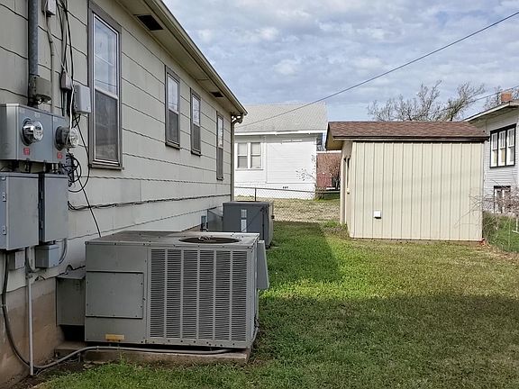 Shared washer and dryer located in outbuilding in back of property.