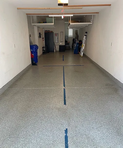 Large tandem garage with MyQ wifi opener, direct access into home, two large ceiling storage shelves and extra storage room.