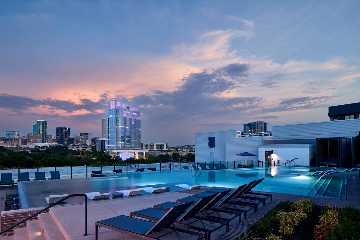 North Building Rooftop Infinity Pool with Outdoor Lounge and Cabanas