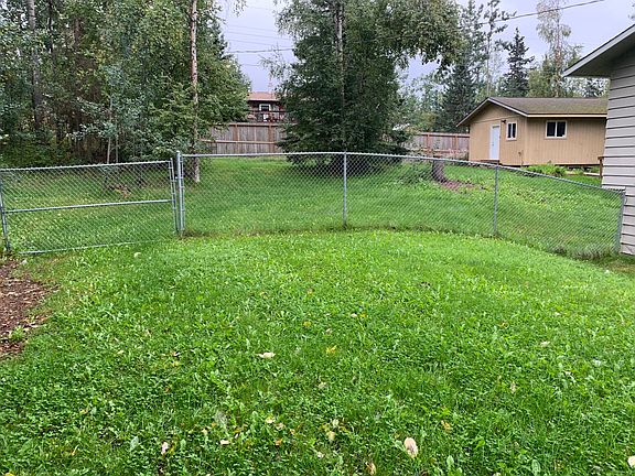 View of fenced back yard