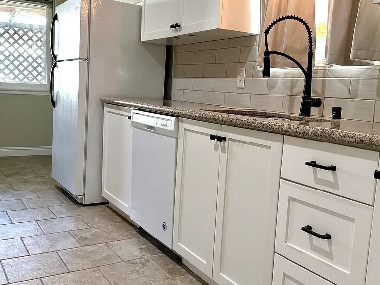 Kitchen view with a newer dishwasher and modern finishes throughout.