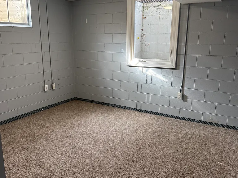 Bedroom on lower level with large egress window