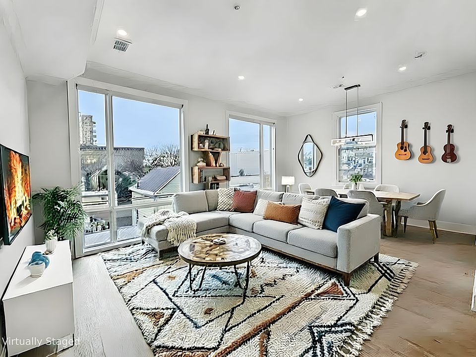 Exit out of your elevator and into this huge living and dining area with beautiful NYC views.