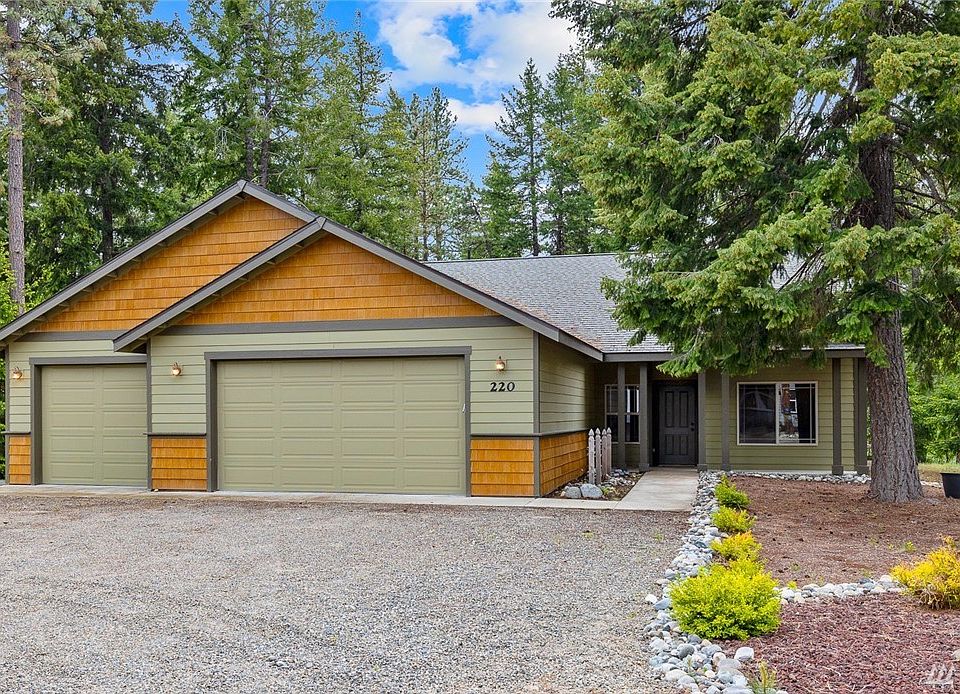Well maintained rambler on a large lot with low maintenance landscape.