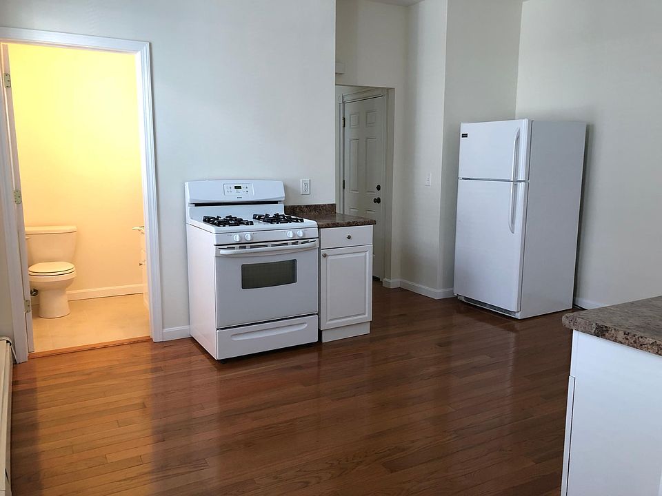 Two windows to the left of this picture brings in nice light. Large Kitchen with hardwood floors, gas stove and pantry.