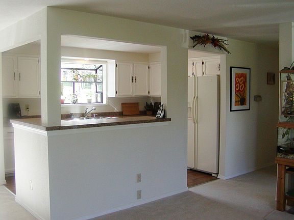 Kitchen is open to the living room making it easy to socialize or even watch T