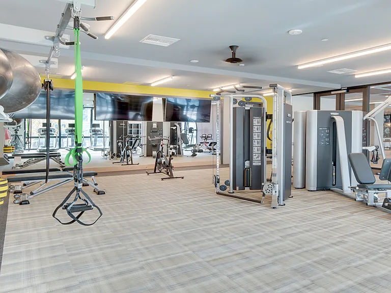 Expansive fitness center with free weights, TRX bands, and more!