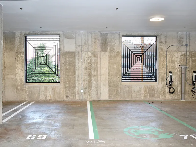 Experience the convenience of dedicated EV charging spaces in the private parking area.