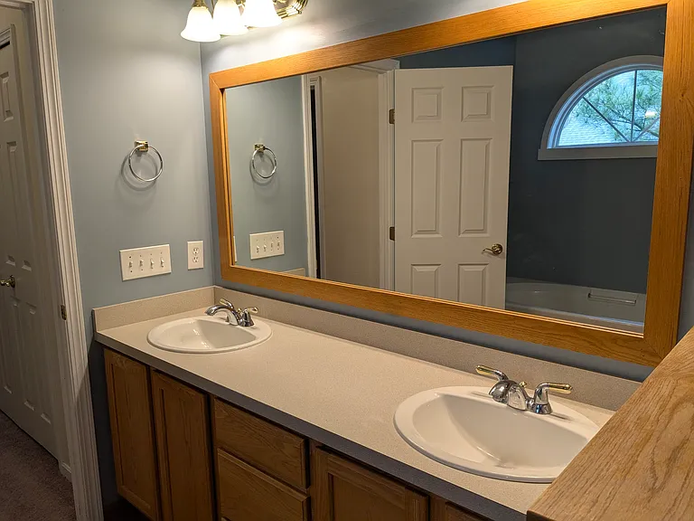 Double sink in master with ample storage in cabinet