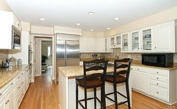 Kitchen features new appliances and modern cabinetry
