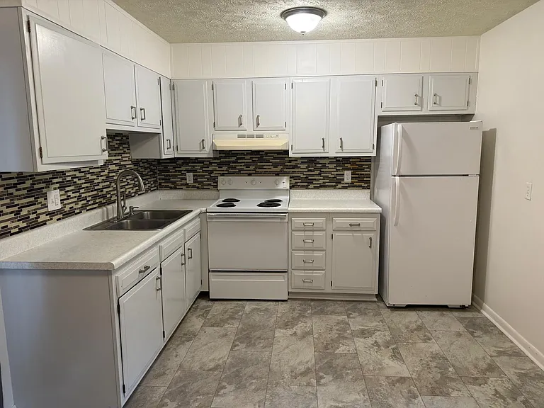 Eat-In Kitchen with doors going out to back - New cabinet paint and wall paint and brand new flooring!