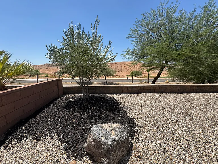 Backyard left corner with golf course view