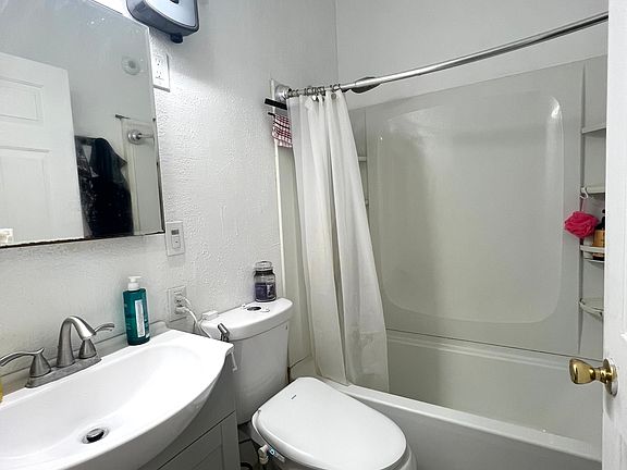 Bathroom with bidet toilet seat