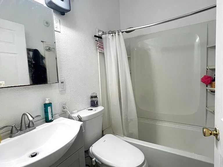 Bathroom with bidet toilet seat