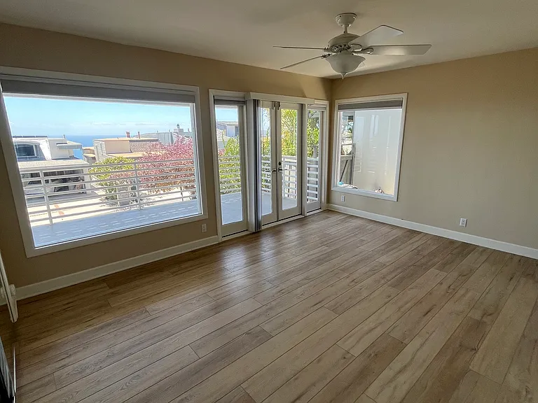 Downstairs front bedroom with HUGE deck (front of house)