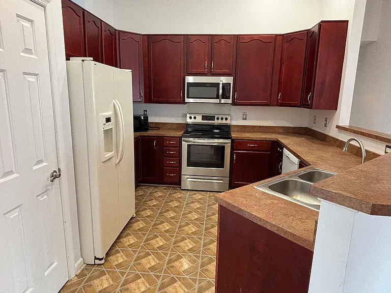 A modern kitchen with ample cabinetry