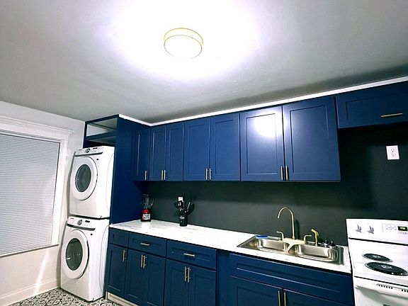 Fully Functional Kitchen for basement level tenets, including a washer and dryer.