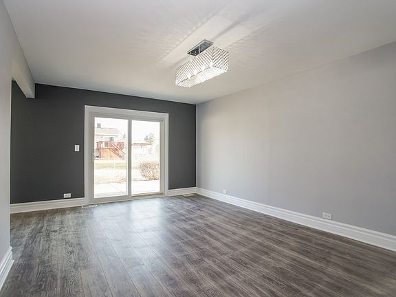 beautiful family room with large patio door allowing natural light to fill the home