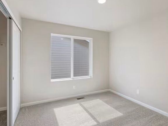 Room for rent with bright sunlight and standard closet. If need more closet space more closets next to room.