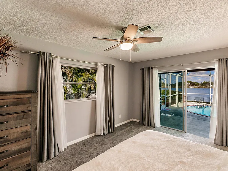 Plenty of space with King size bed. Currently rearranged with side tables and King size bed under window.