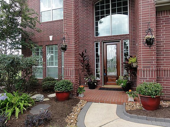 Beautiful landscaped front yard gives welcoming curb appeal.