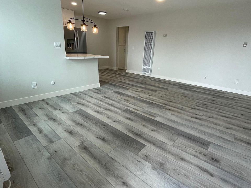 View from front door, this unit has vinyl plank flooring