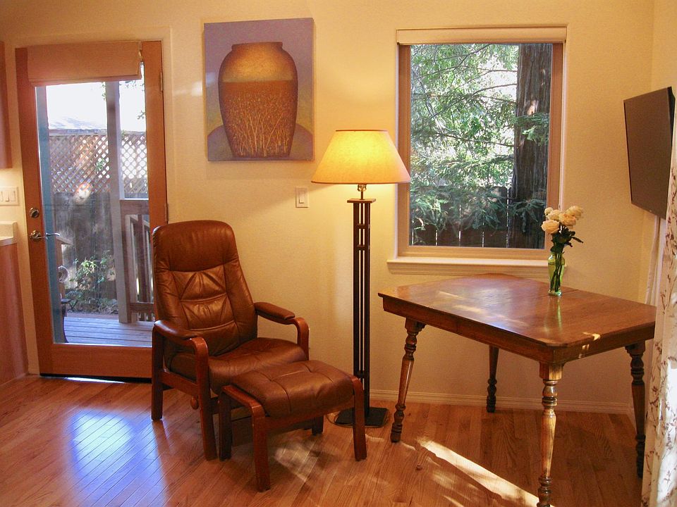 Hardwood floors, recliner, lamp, table and Smart TV