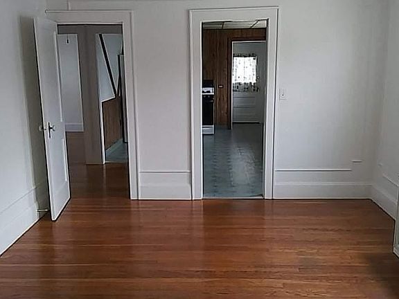Dining room from living room arch. Left, hall to bath and bedrooms, right to kitchen.