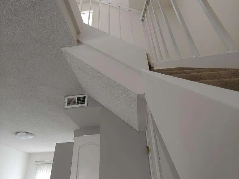 Contemporary Staircase to all 3 levels of townhouse