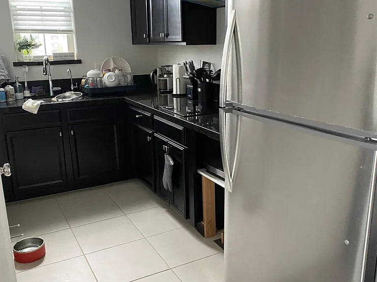 kitchen with cooking range, refrigerator, oven and microwave and R/O drinking water system