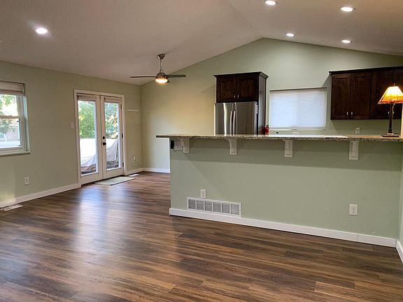 Second view - living towards kitchen, eating space and deck.